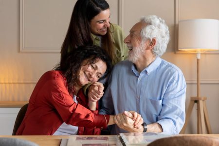 A joyful family moment with three generations smiling together at home, symbolizing peace of mind and strong relationships protected by proper estate planning and testamentary capacity. TLR Law in Winnipeg helps ensure your will stands up to challenges and reflects your true wishes.