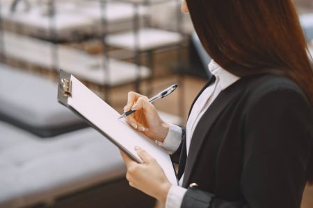 Executor reviewing estate documents and paperwork, reflecting the responsibilities, timelines, and legal duties of estate administration with guidance from TLR Law in Manitoba.