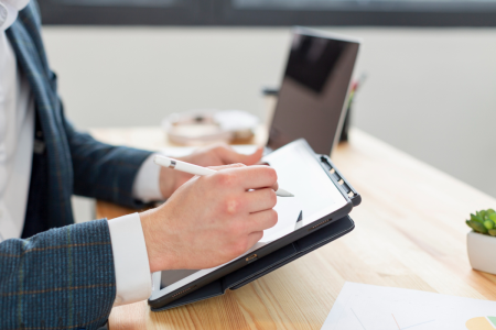 A lawyer from TLR Law Firm in Winnipeg reviewing digital estate planning documents to help protect clients’ online legacies.